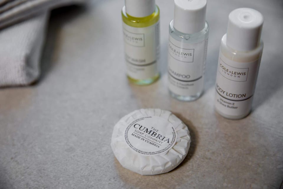 Designer toiletries, hair dryer, towels, soap