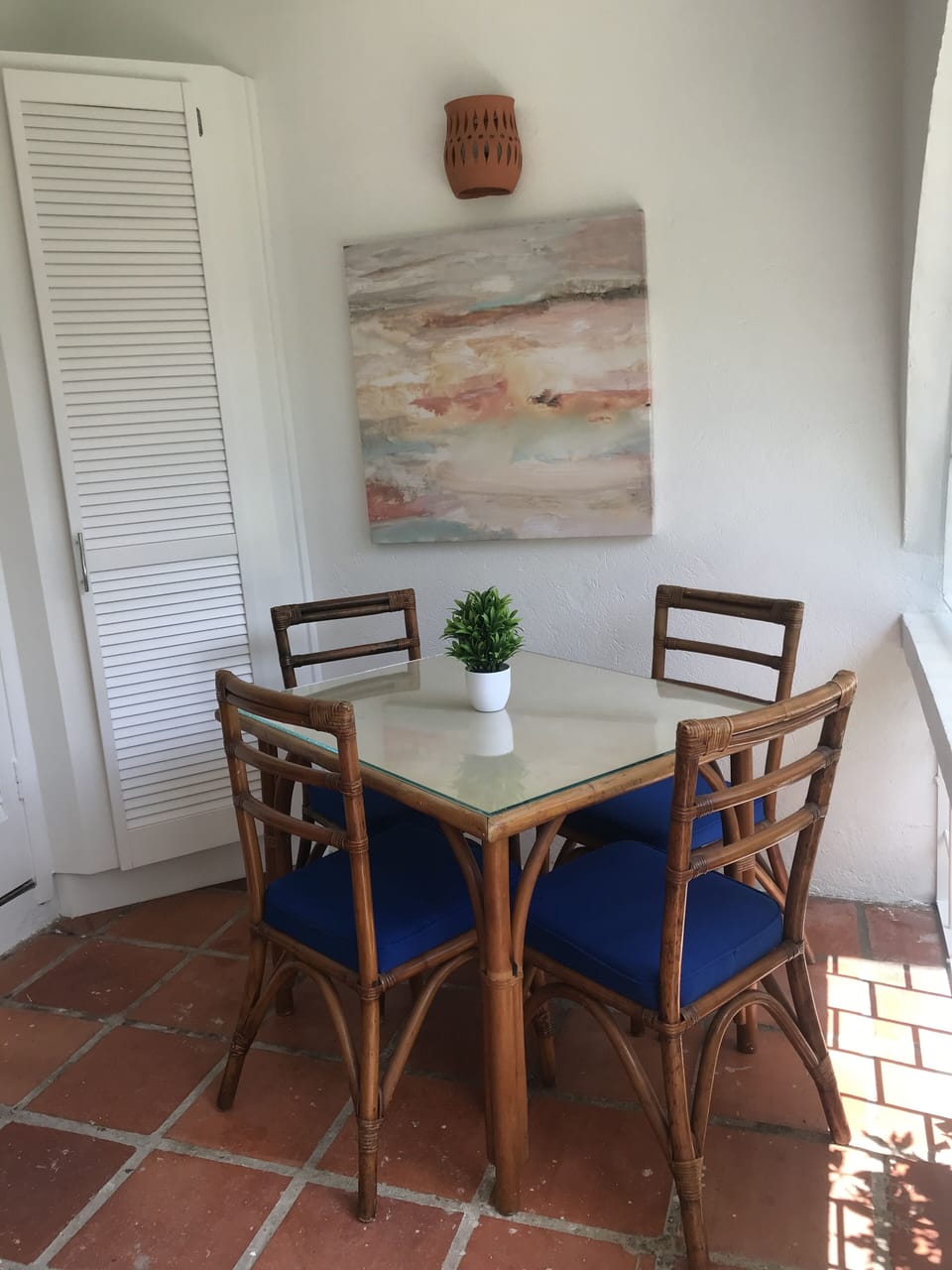Dining table on patio, for comfortable dining with garden views.