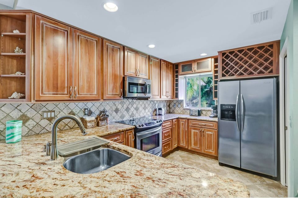 Cookware, dinnerware, many electrical appliances & kitchen tools are provided.