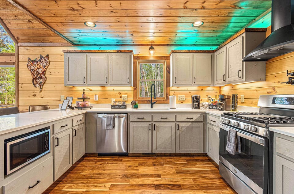 A Chef's Kitchen with oven, griddle and fully stocked with appliances for family and big event cooking.