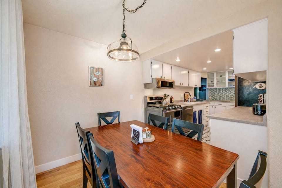 Charming dining area featuring a wooden table and a comfortable setting for shared meals.