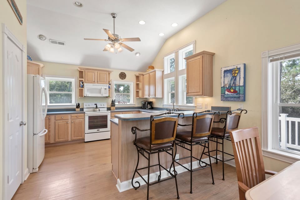 CL514: Plum Paws | Top Level Dining Area and Kitchen