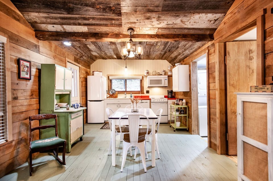 The spacious dining area is perfect for gatherings, with vintage-inspired touches that make every meal feel special.