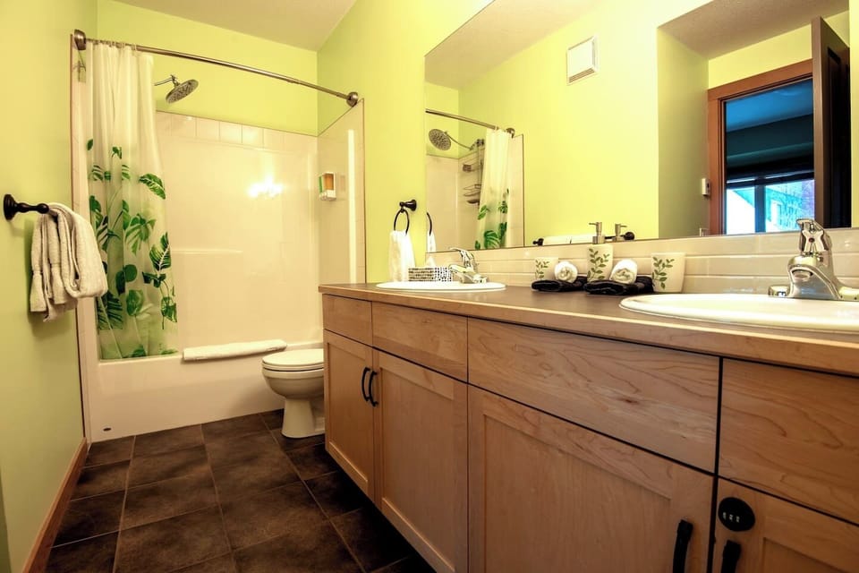 Master ensuite bathroom, with his and hers sink, shower, and tub.   Heated floor! 