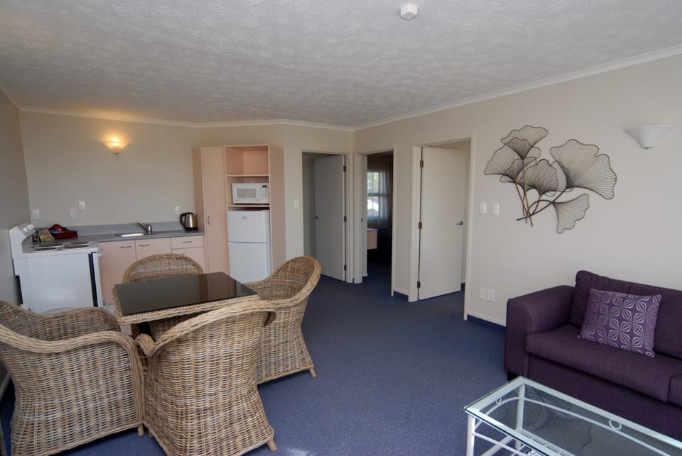 Two Bedroom Suite | Living area | 43-inch LCD TV with satellite channels, TV