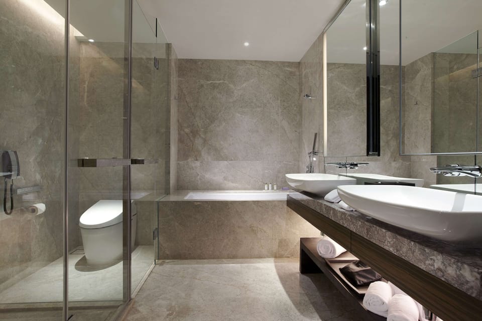 Suite, 1 King Bed (Prestige) | Bathroom | Hair dryer, bathrobes, slippers, bidet