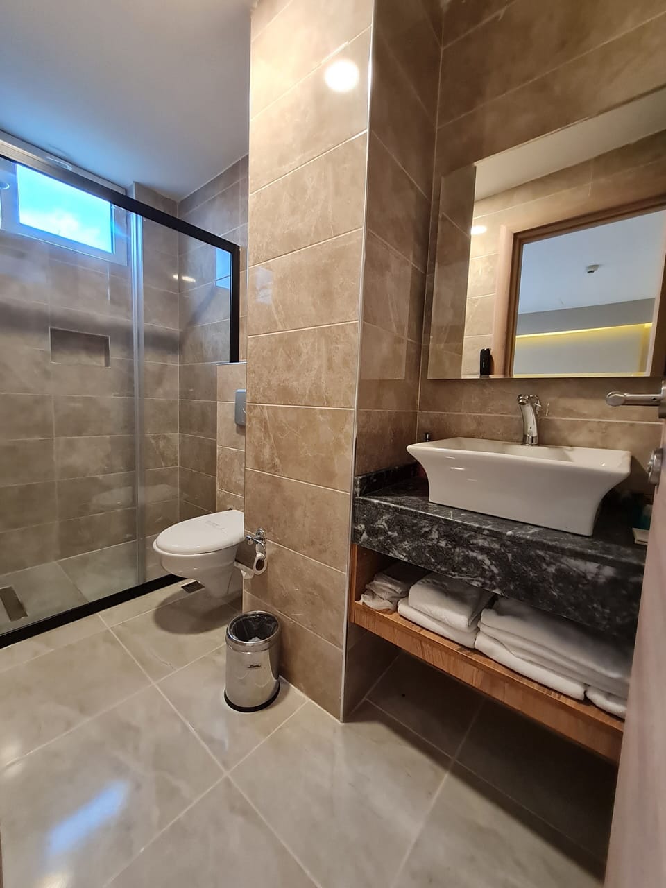 Shower, hair dryer, slippers, towels