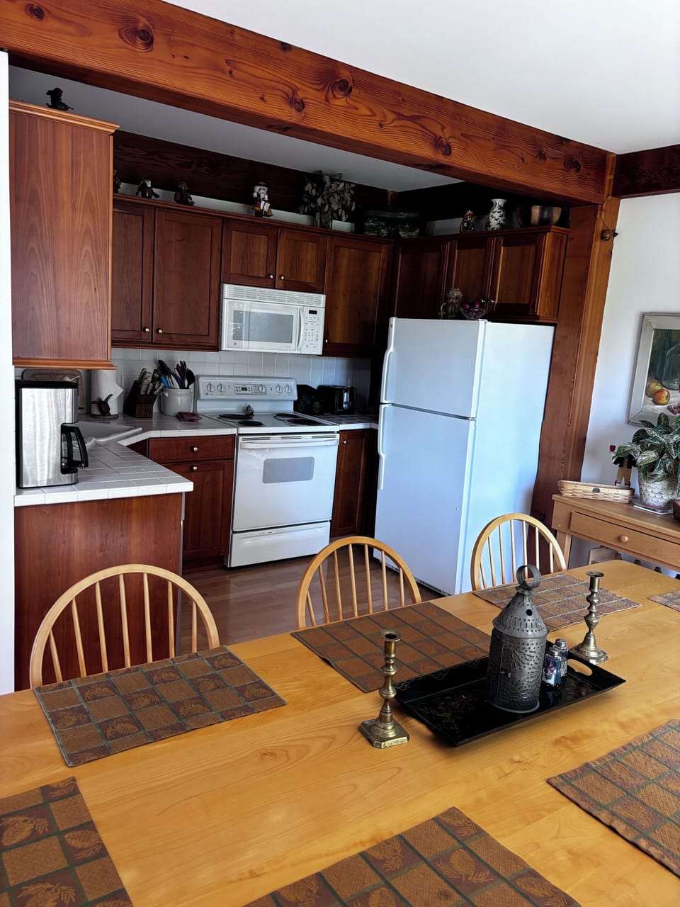 Kitchen with fridge, stove, microwave & dishwasher.