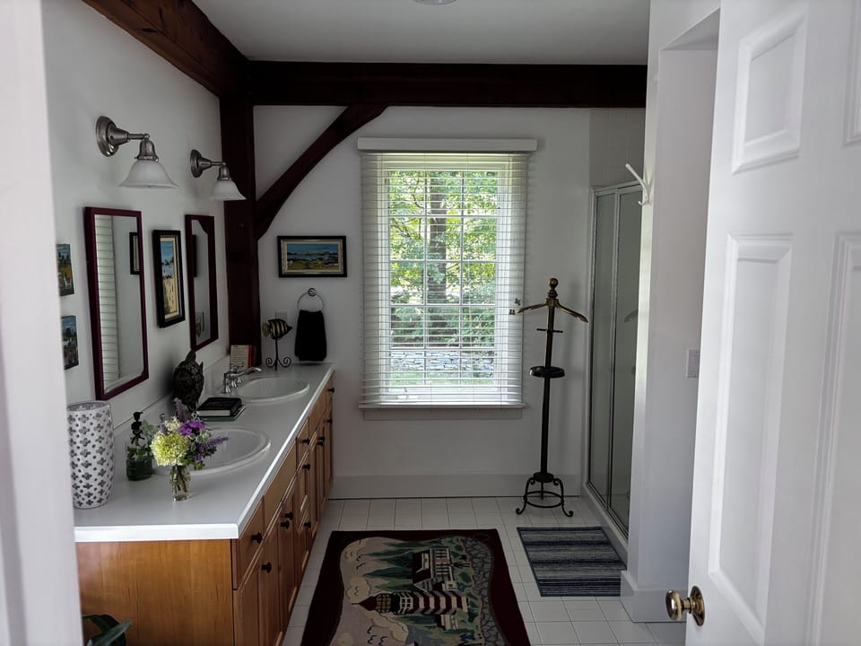 Downstairs bathroom. Shower stall and washer & dryer.
