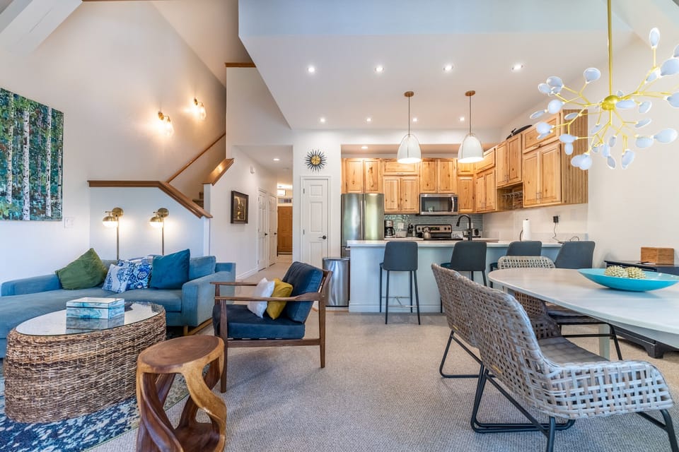 Relax in your stylish open-concept retreat where vaulted ceilings meet modern comfort. Cook meals in your full kitchen, then gather around the dining table.