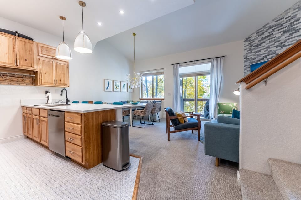 Your open-concept space flows beautifully from the modern kitchen to your cozy living room, creating the perfect setting for relaxation.