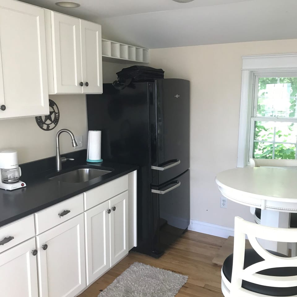 3rd Floor Sitting Area with Large Refrigerator and Sink