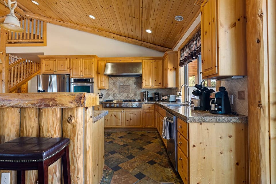 Gourmet kitchen with knotty pine cabinets.