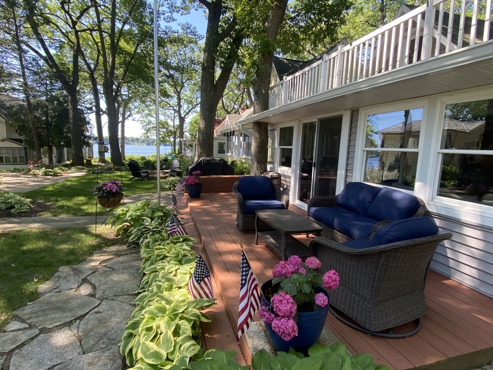 Gorgeous Lake Views from the front entrance deck and Firepit area! Walking path.