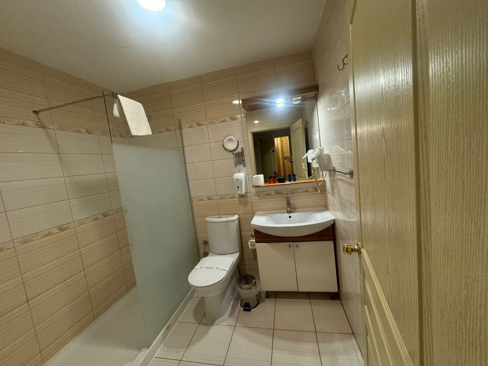 Hair dryer, slippers, towels, soap