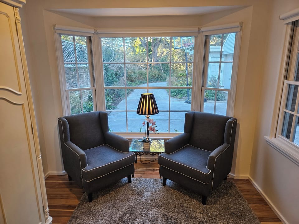 5th bedroom, luxury KING bed, garden vista, lounge and wardrobe.