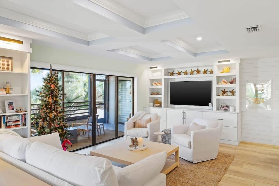 Oversized LED smart TV in the living area, perfect for relaxing after a long day at the beach
