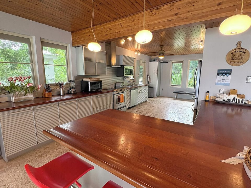 The kitchen includes a bar top with stools.  I perfect spot to plan your day