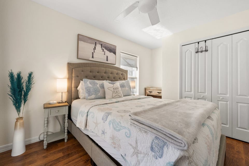 The third bedroom has a Queen bed, a phone charging station.