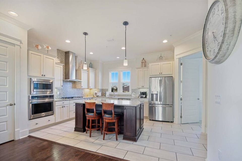 Sunrise and Sunsets- Kitchen with high end appliances and kitchen island seats 2