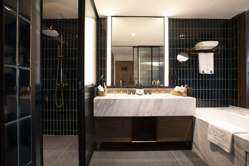 Eden Deluxe Bedroom | Bathroom | Eco-friendly toiletries, hair dryer, bathrobes, slippers