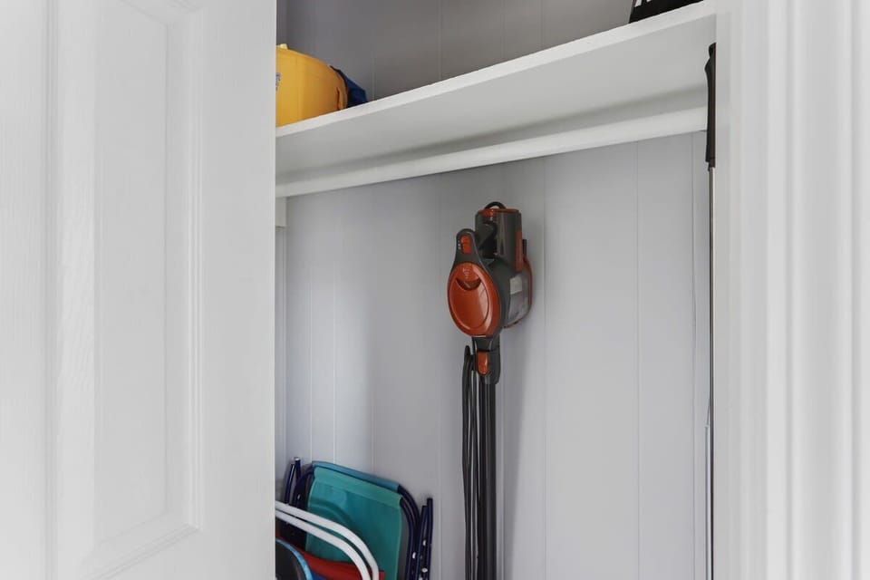 Storage for beach chairs and umbrellas in the hall closet
