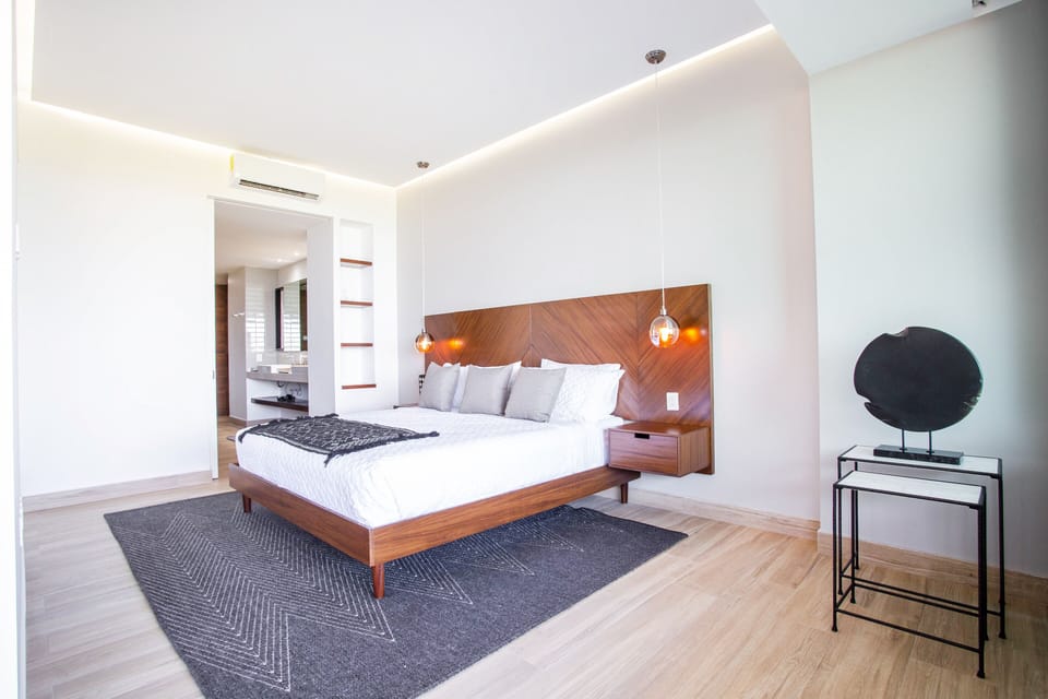 Bright master bedroom with king size bed