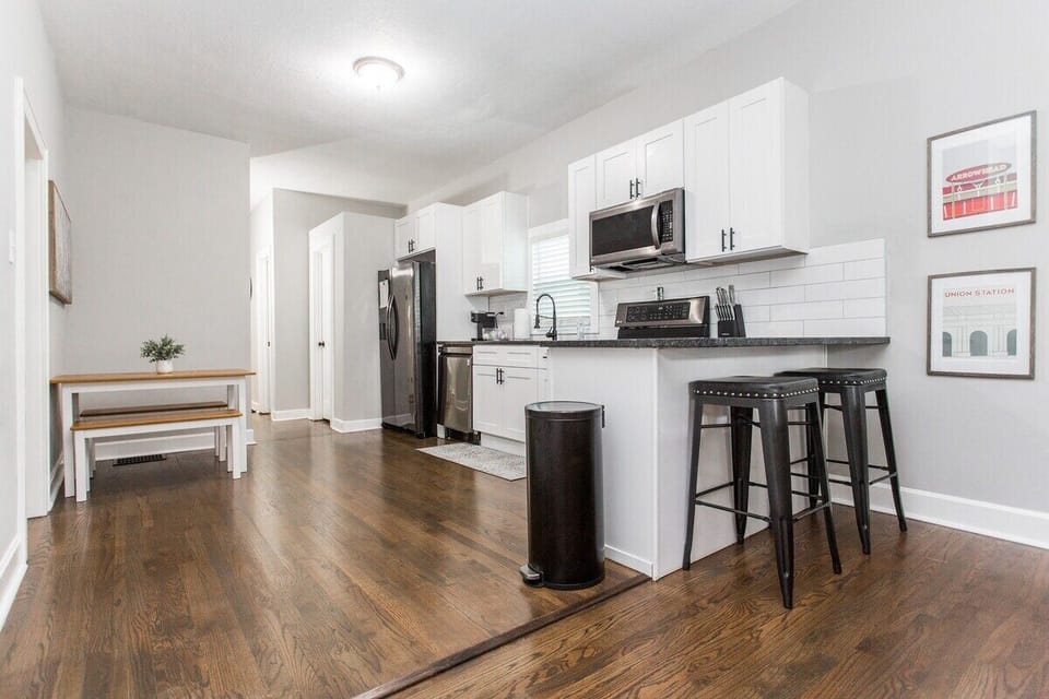 Kitchen seating, bar seating, open kitchen with stainless steel appliances!