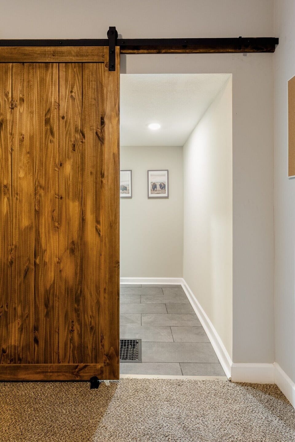 Barn door leading to the master bathroom