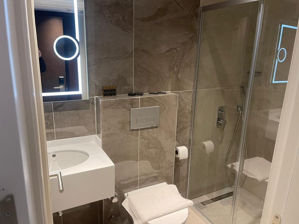 Shower, free toiletries, hair dryer, slippers