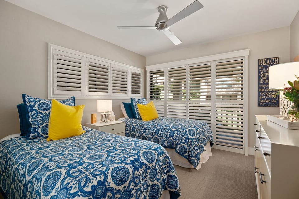 Second bedroom with two twin beds.