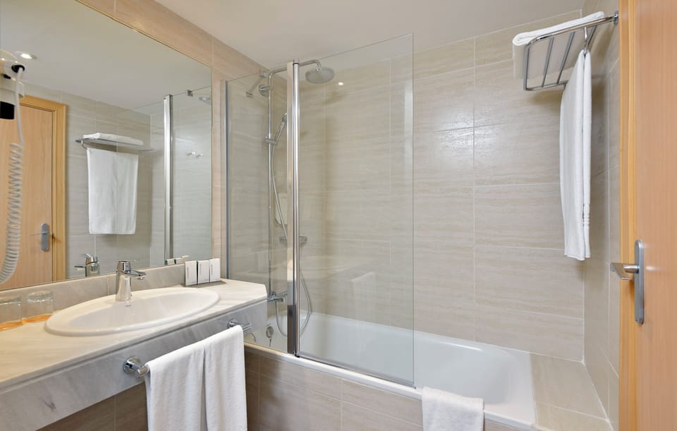 Eco-friendly toiletries, hair dryer, towels