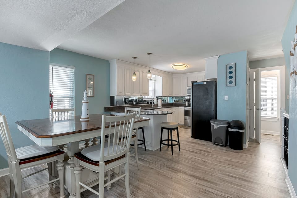 Open floor plan with dining area and kitchen. Half bath on this floor too. 