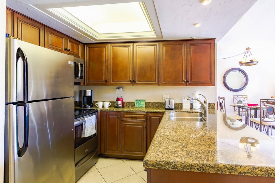 Just the right size full kitchen with granite counters and stainless appliances.