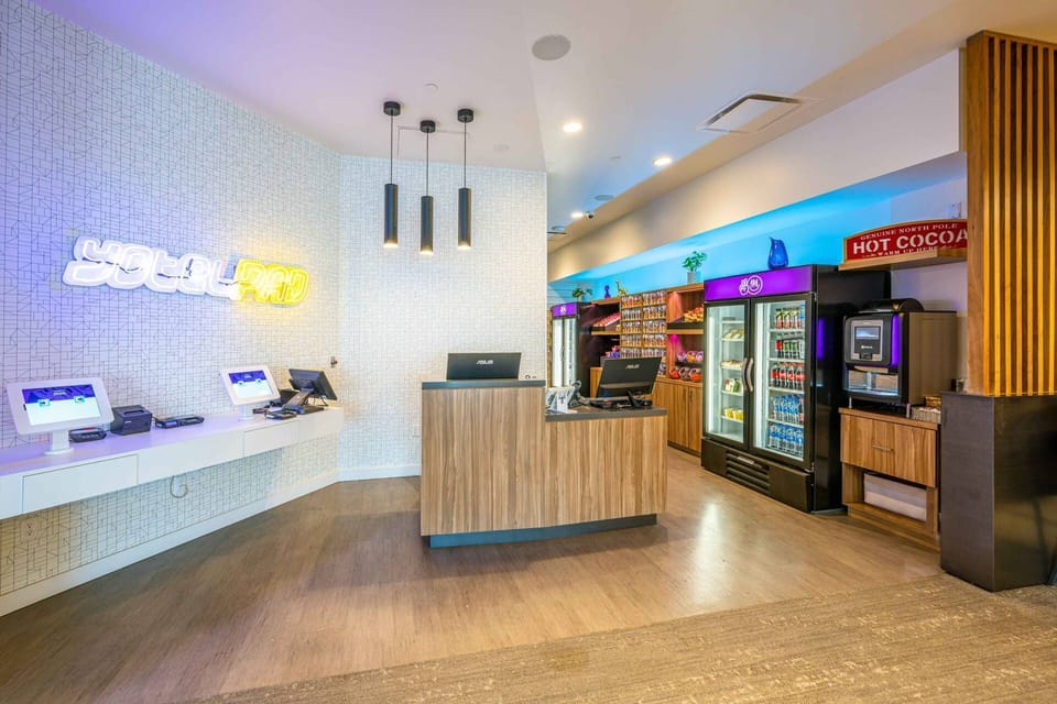 The lobby features a fully staffed front desk and a grab and go store where snacks are available for purchase