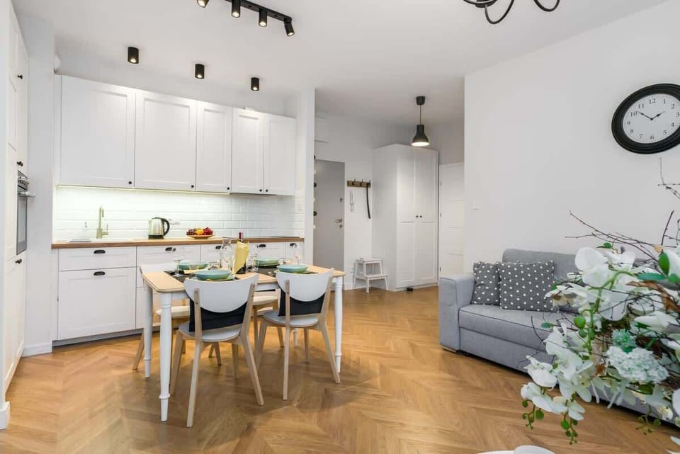 The living room's modern and stylish decor creates a welcoming atmosphere. 