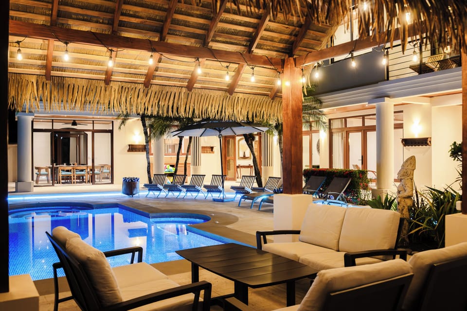 Outdoor lounge space under a palapa