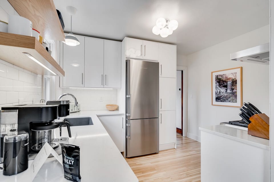 Your sleek, modern kitchen awaits with stainless steel appliances, pristine counters, and everything you need to cook memorable meals.
