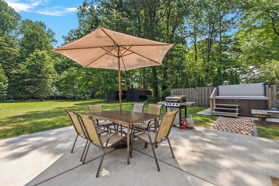 The backyard is perfect for entertaining with a pool, outdoor shower and bathroom, dining area, BBQ grill, huge lawn & fire pit.