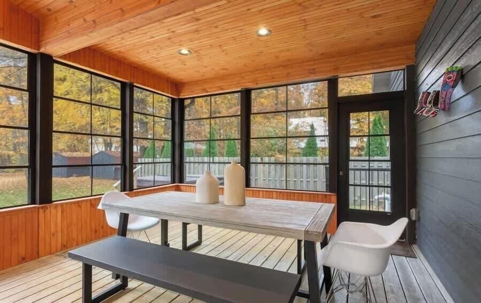 Picnic table-style dining on the porch is a great option for the "kids table".