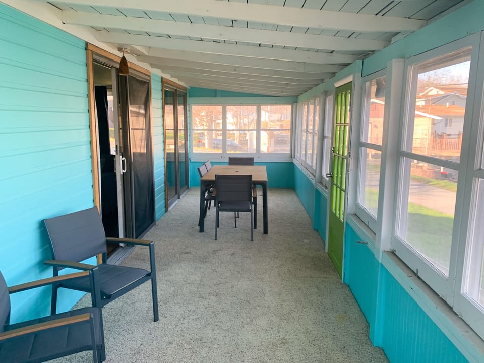 More seating for year-round use. Open the windows for a screened porch.