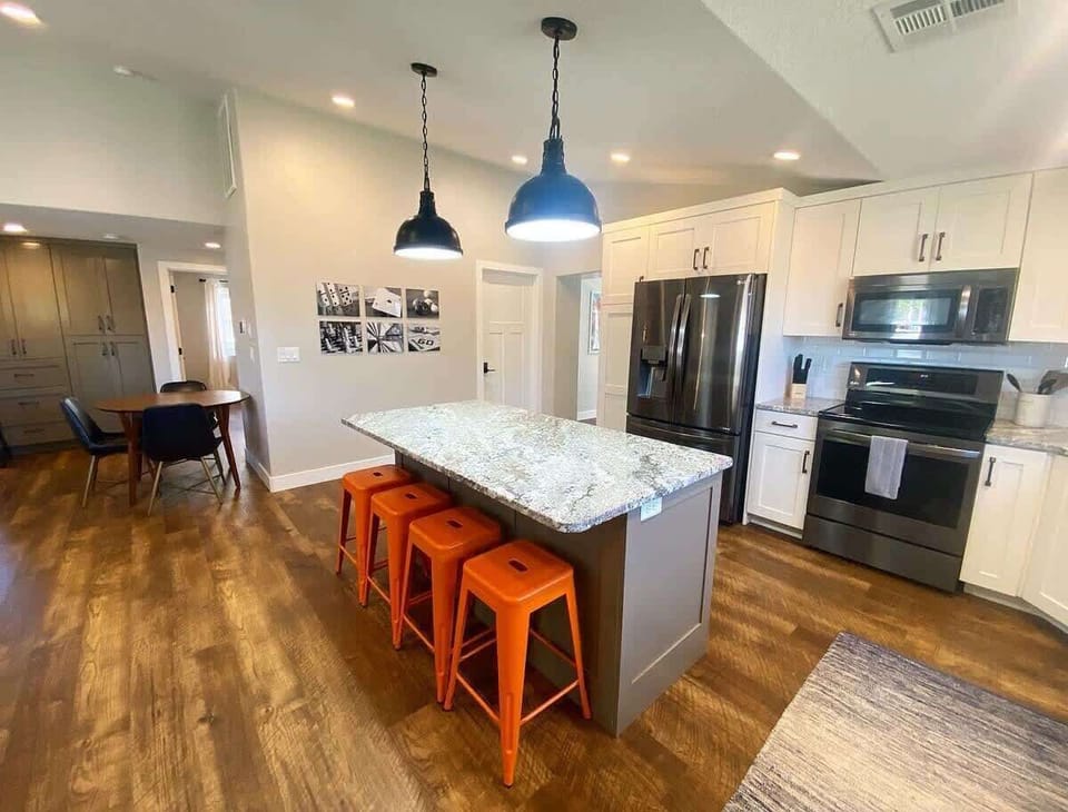 There's no shortage of space for your guests to enjoy hanging out in the large kitchen for cocktails before dinner!