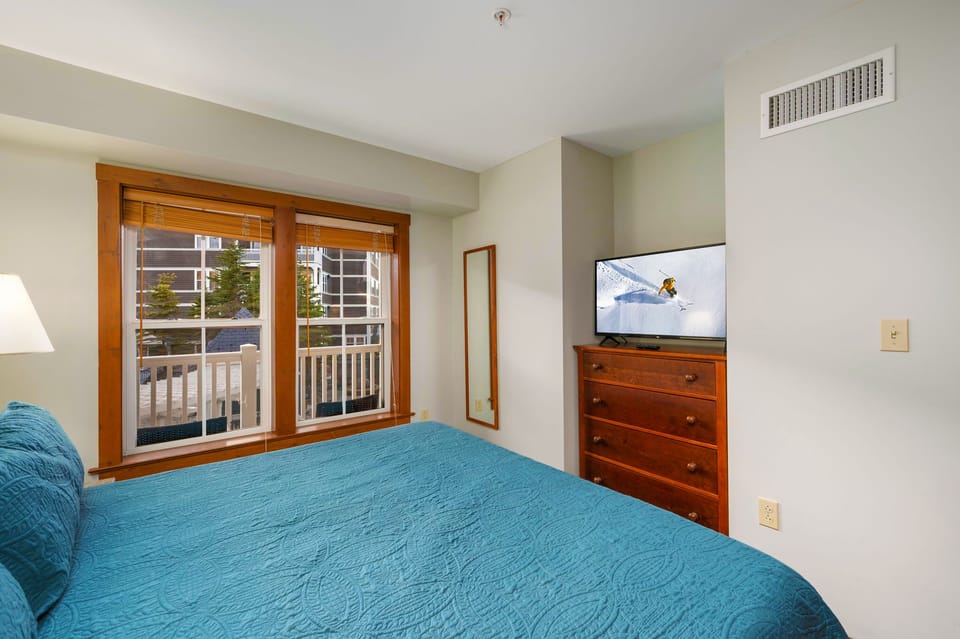 Cozy up and relax in this King Bedroom with a Smart TV!