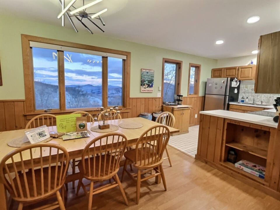 Inviting dining area with a mountain view through the window.