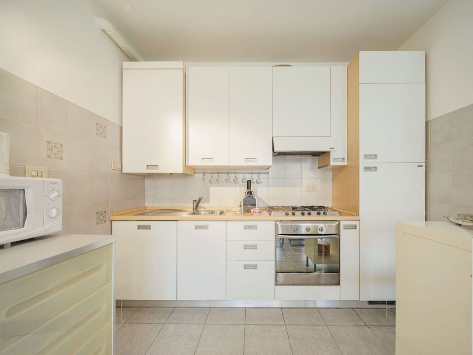 Cabinetry, Kitchen Sink, Countertop, Sink, Tap, Building, Furniture, Kitchen Stove, Kitchen Appliance, Plumbing Fixture