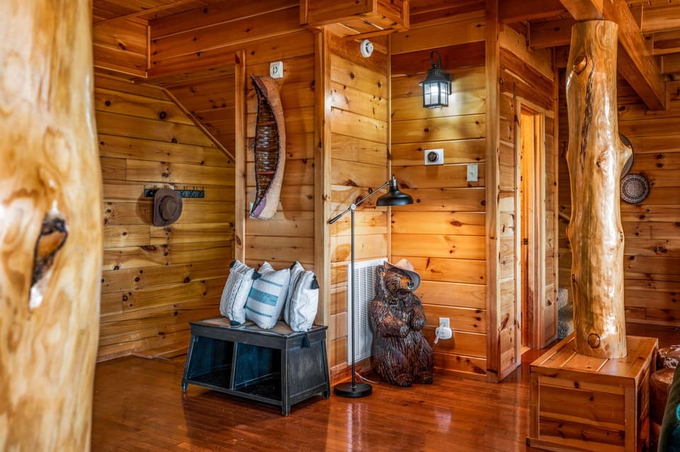 Entryway bench with boot storage and coat hooks
