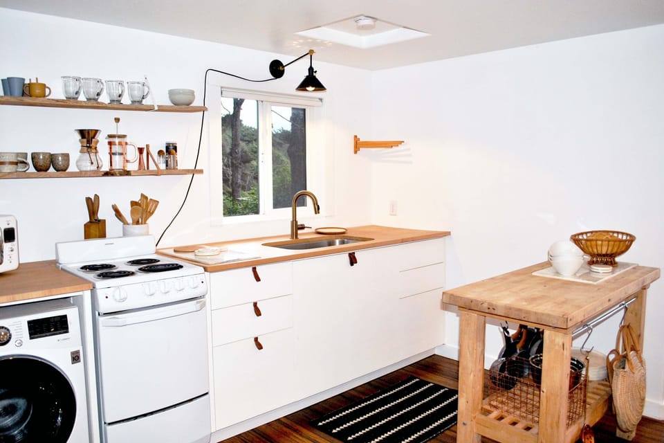 The compact kitchen is perfect for this space.