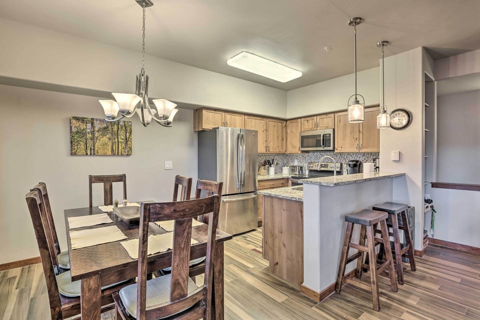 Dining Area | Breakfast Bar w/ Additional Seating | Dishware & Flatware Provided