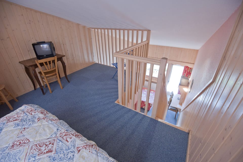 Family Quadruple Room | Premium bedding, desk, laptop workspace, blackout drapes
