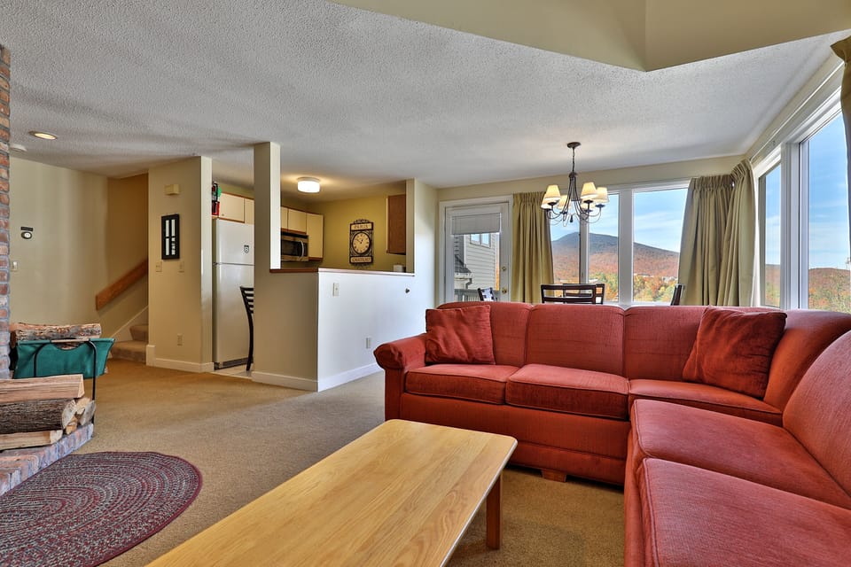 View from the living area to the fully equipped kitchen and dining area